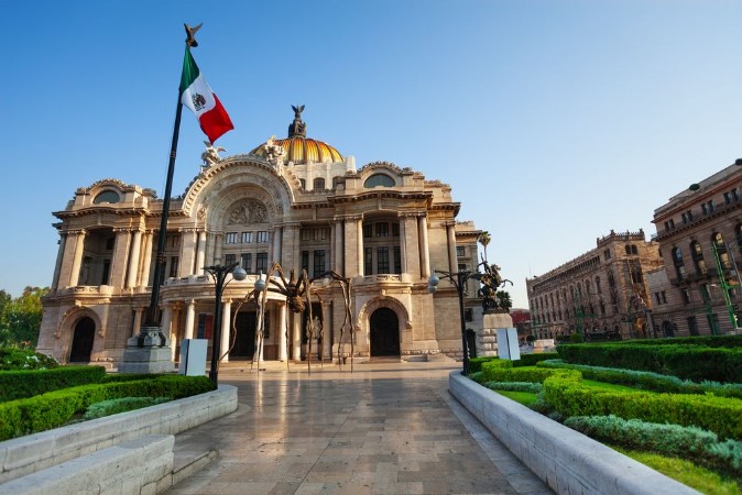 Picture of Palace of fine arts facade and Mexican flag