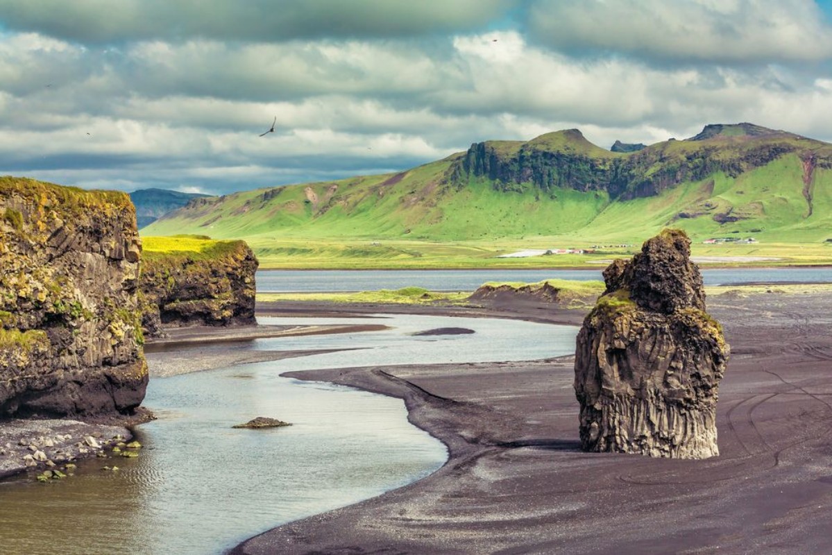 Picture of The black sand beach with typical Icelandic mountain landscapes