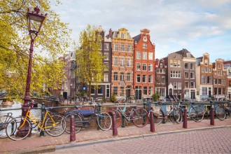 Picture of Bicycles parked on a bridge in Amsterdam