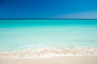 Picture of Shore of classic turquoise Caribbean Sea dream beach under bright blue sky in Varadero Cuba