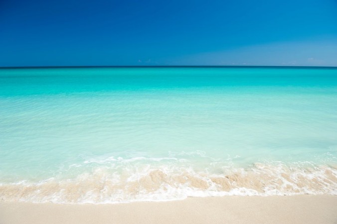 Picture of Shore of classic turquoise Caribbean Sea dream beach under bright blue sky in Varadero Cuba
