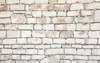 Afbeeldingen van Old stone wall detailed background texture