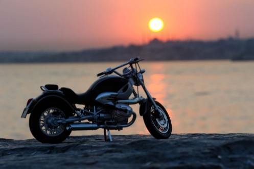 Picture of Motorcycle on the rocks in sunset and golden hours