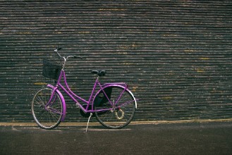 Picture of Classic Vintage Purple Hipster Bicycle on the Street