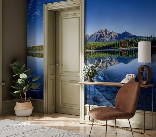 Picture of Colorful trees lined the shores of Patricia Lake at Jasper National Park with Pyramid Mountain in the background The calm lake reflects a mirror image of the mountains and trees