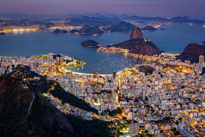 Spectacular aerial view over Rio de Janeiro as viewed from Corcovado The famous Sugar Loaf mountain sticks out of Guanabara Bay photowallpaper Scandiwall