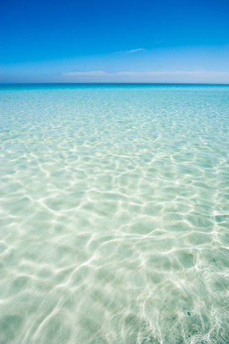 Picture of Shore of classic turquoise Caribbean Sea dream beach under bright blue sky near the resort town of Varadero Cuba