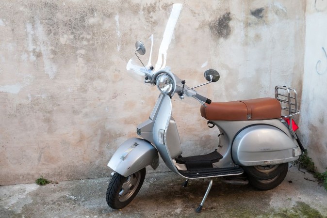 Picture of Classical yellow scooter stands parked