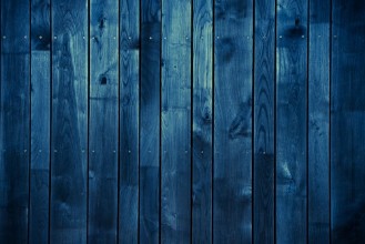 Ritratt ta’ Dark Blue Wood Background