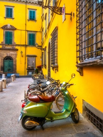 Picture of European motorbikes scooters vespas parked in Lucca Italy