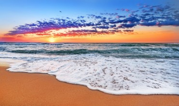 Ritratt ta’ Colorful ocean beach sunrise