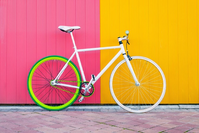 Image de City bicycle fixed gear on yellow and red wall