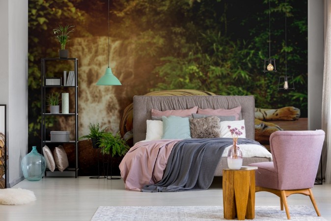 The big tiger sleeps on a rock at a waterfall photowallpaper Scandiwall